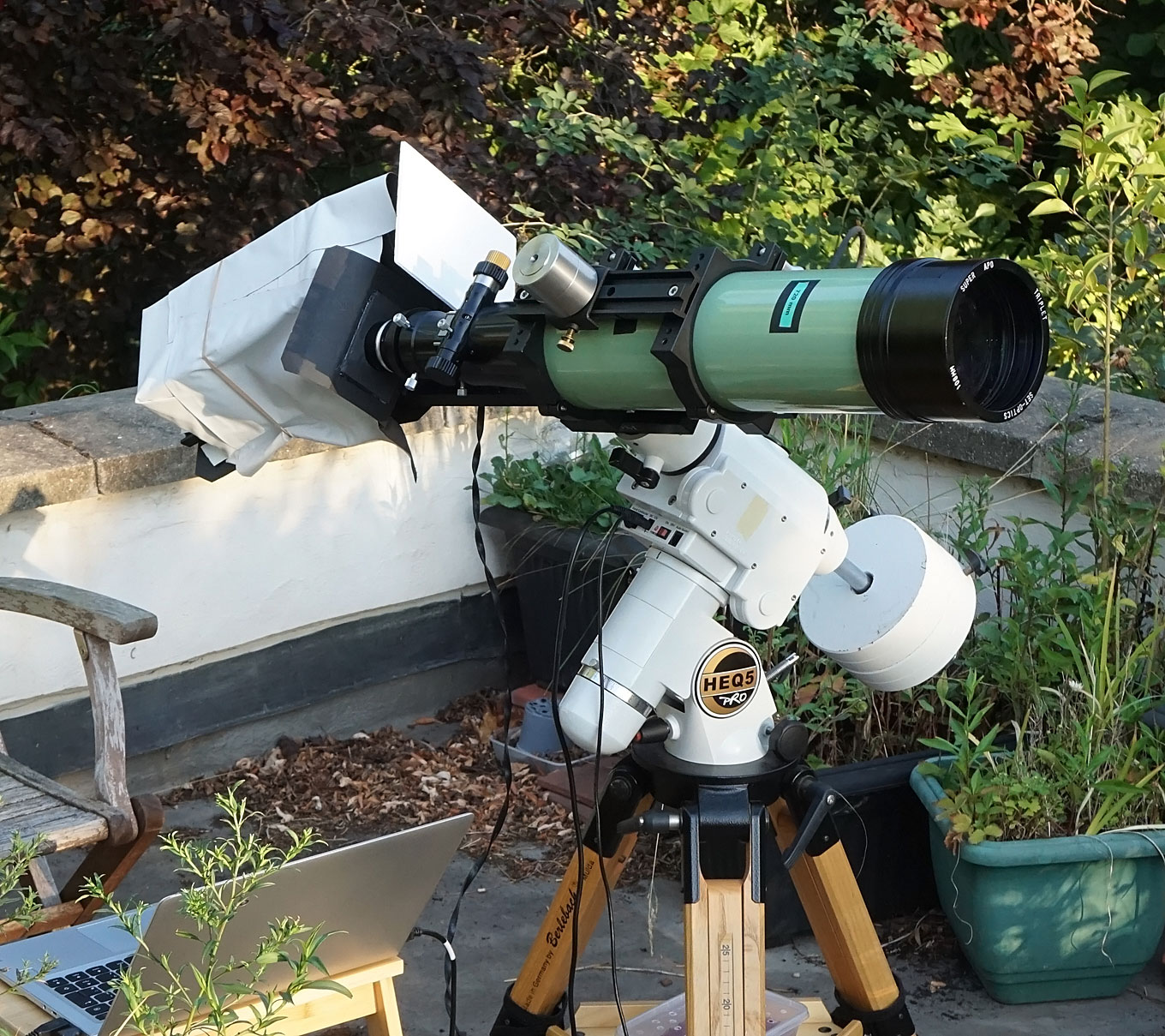SHG setup. APO triplet refractor, HEQ5 Pro mount. Note the telescope is pointed at the eastern horizon to get the early morning light. This photo was taken just before the Sun rose over the trees.